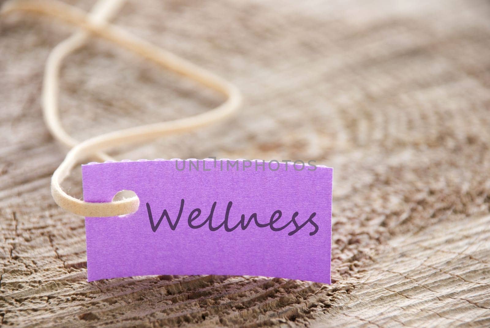 a purple label with wellness on it as background