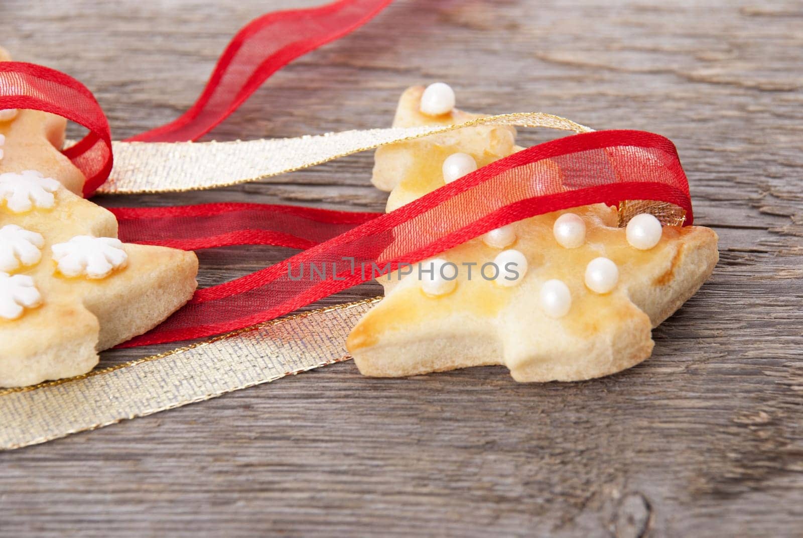 christmas cookies wrapped in red and golden ribbon, christmas background