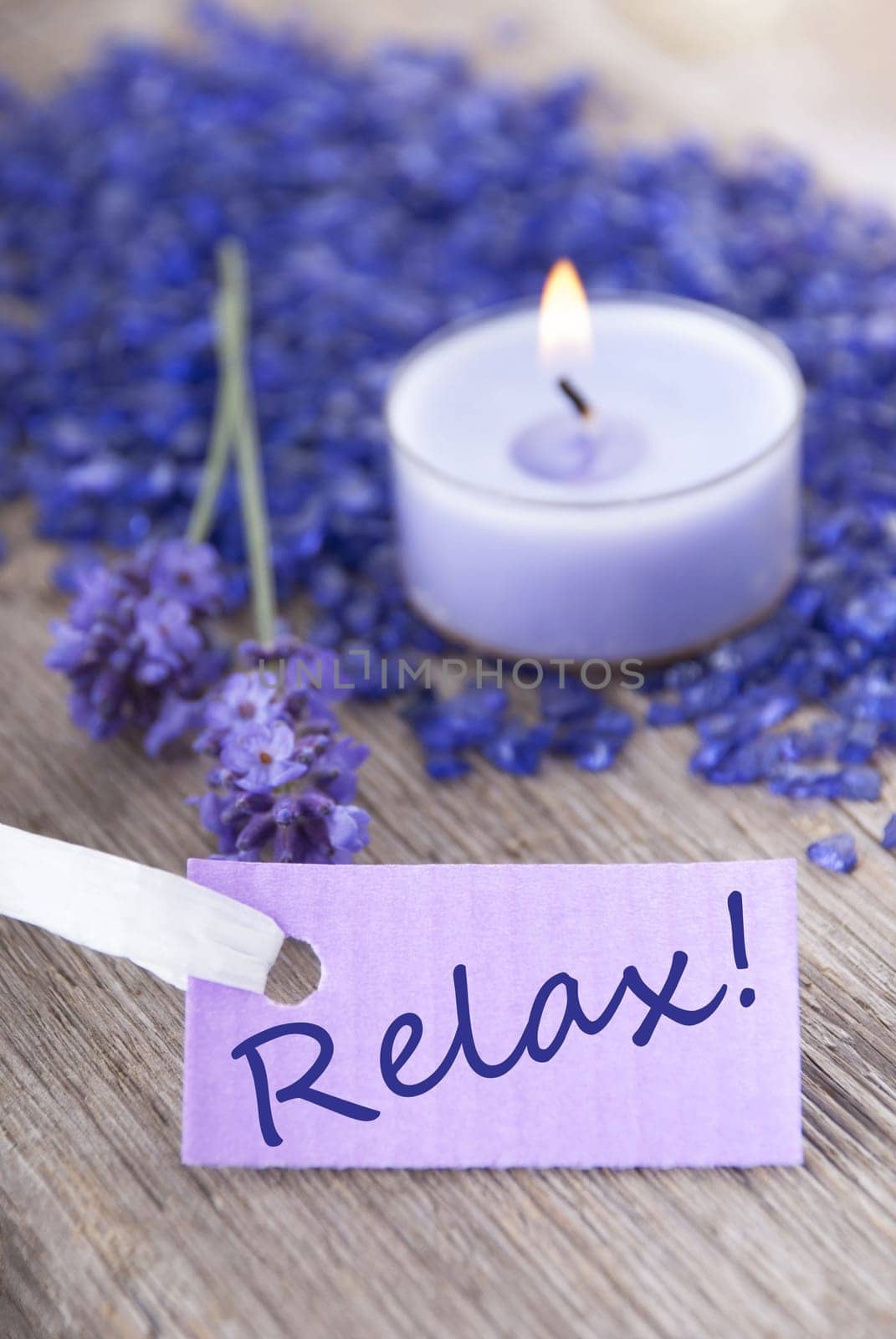 the word relax on a purple label with recreation background