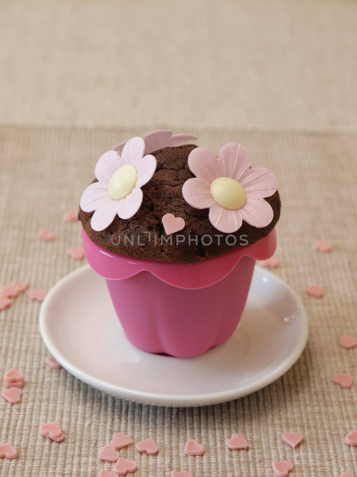 Sweet muffin with flowers and heart shapes