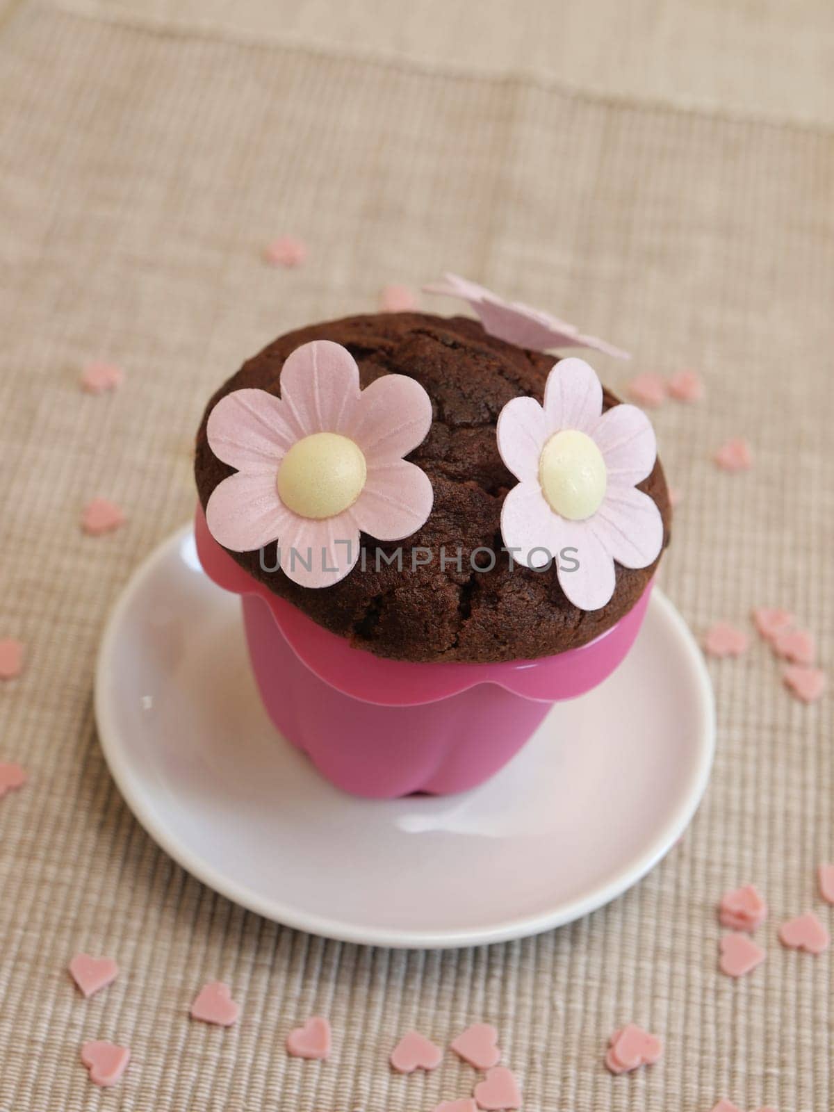 Sweet muffin with flowers and heart shapes