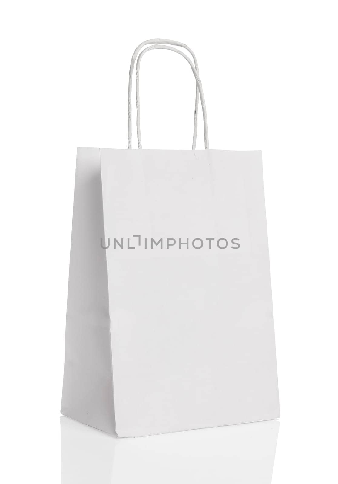 White paper shopping bag isolated with reflection