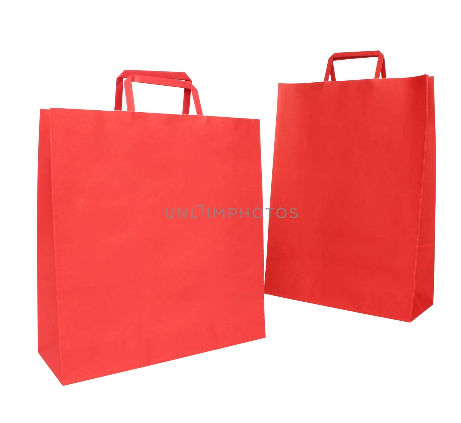 Two red paper shopping bags over white