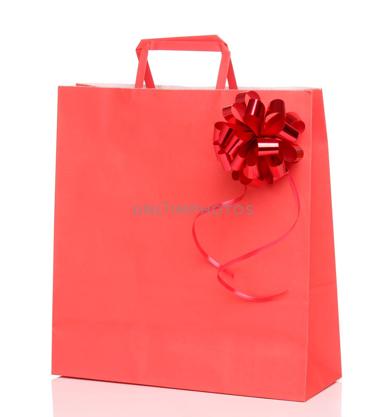 Red paper shopping bag with a ribbon over white