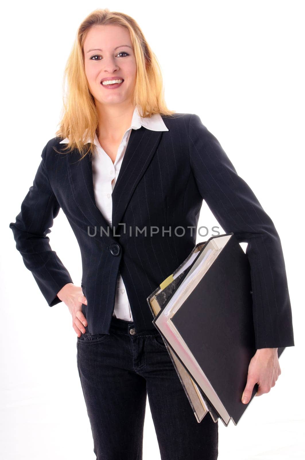 Attractive young woman with long blond hair in a business outfit isolated against a white background.