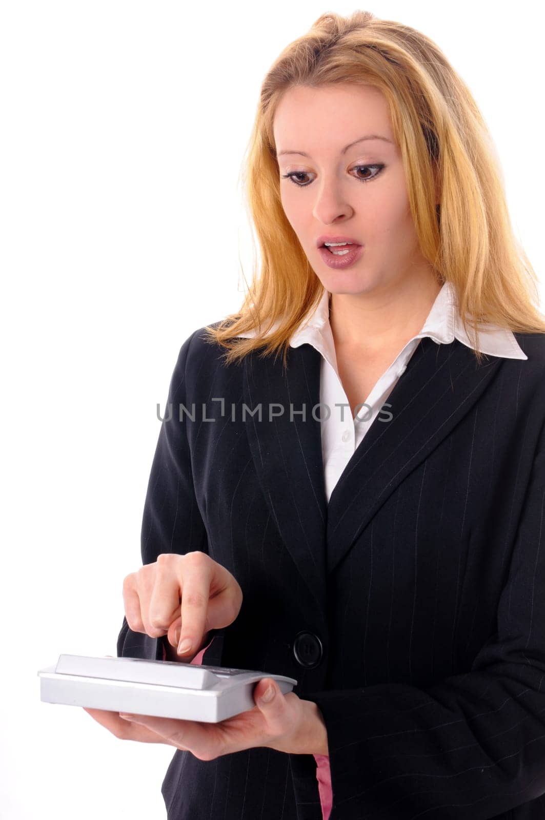 Attractive young woman with long blond hair in a business outfit isolated against a white background.