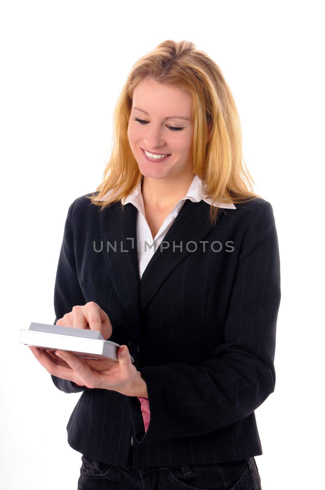 Attractive young woman with long blond hair in a business outfit isolated against a white background.