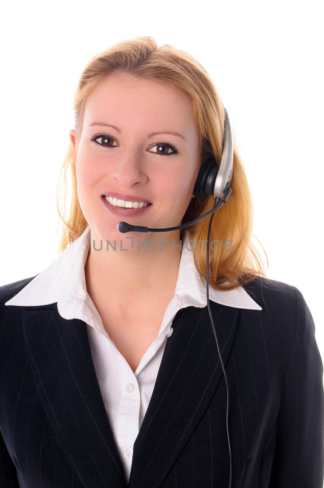 Attractive young woman with long blond hair in a business outfit isolated against a white background.