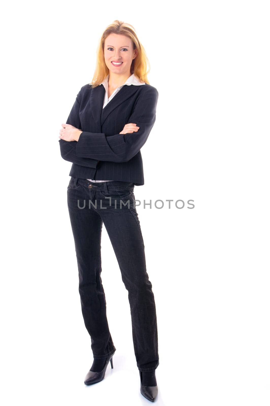 Attractive young woman with long blond hair in a business outfit isolated against a white background.
