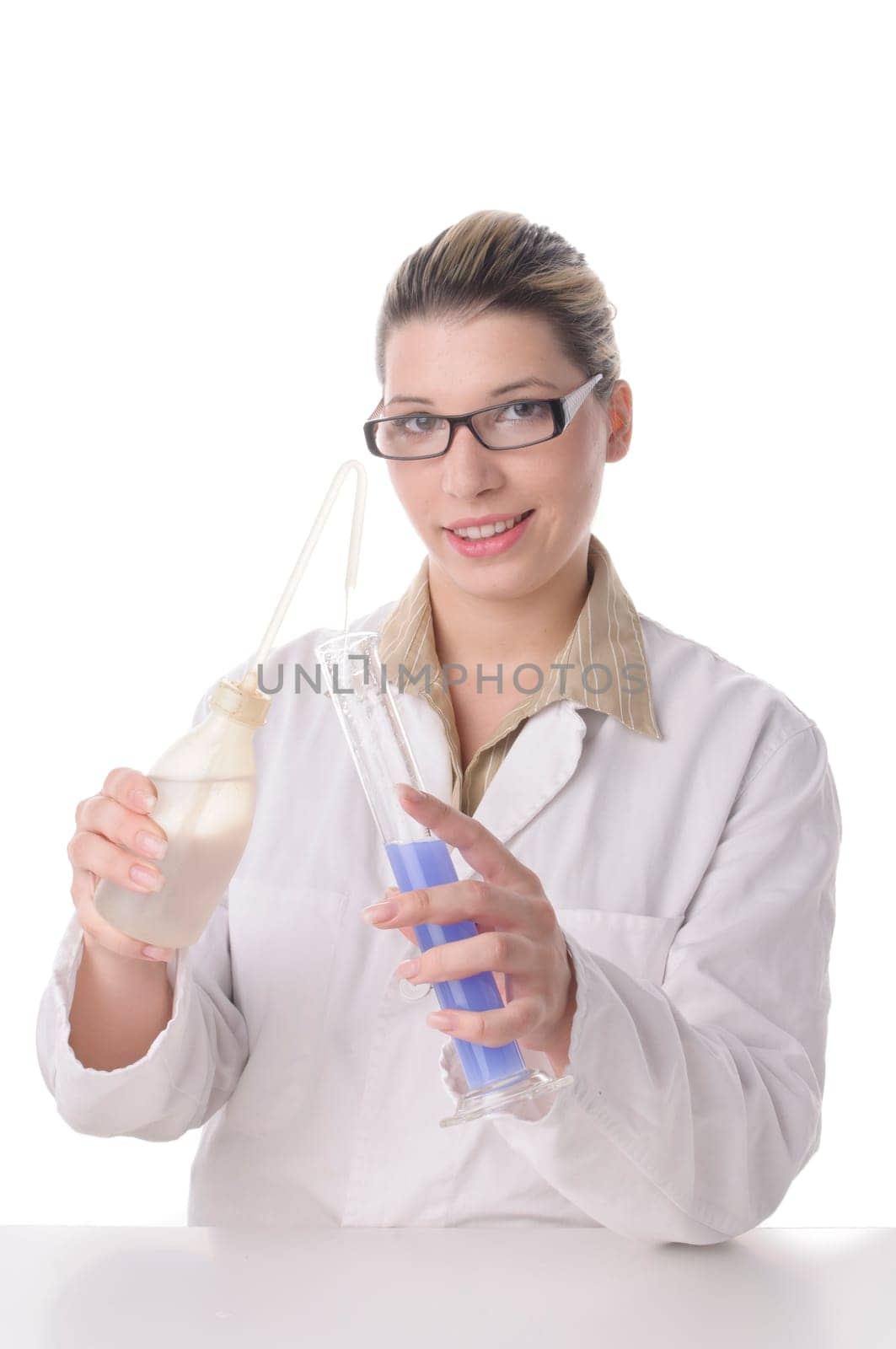 A young pretty woman wears a white coat and handles chemicals and glass bulbs,insulated against a white background.