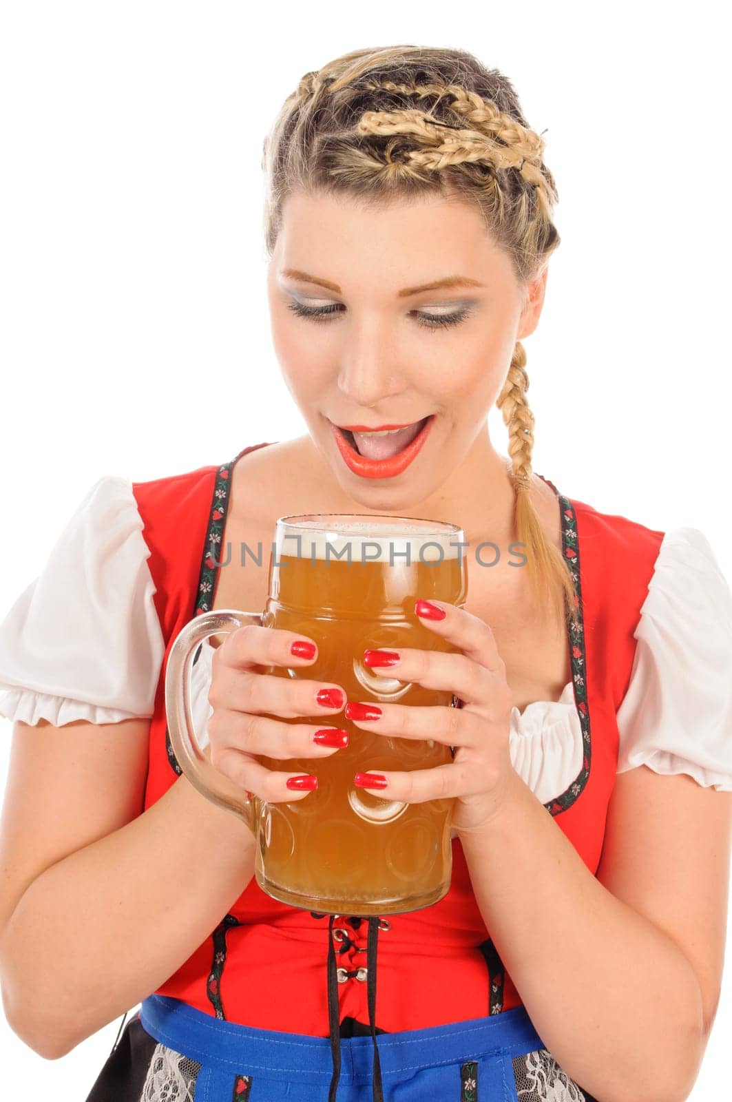 Young attractive woman with blond hair and braids wears a colorful dirdl dress and holds a mug of freshly tapped beer in her hand,exposed against a white background.