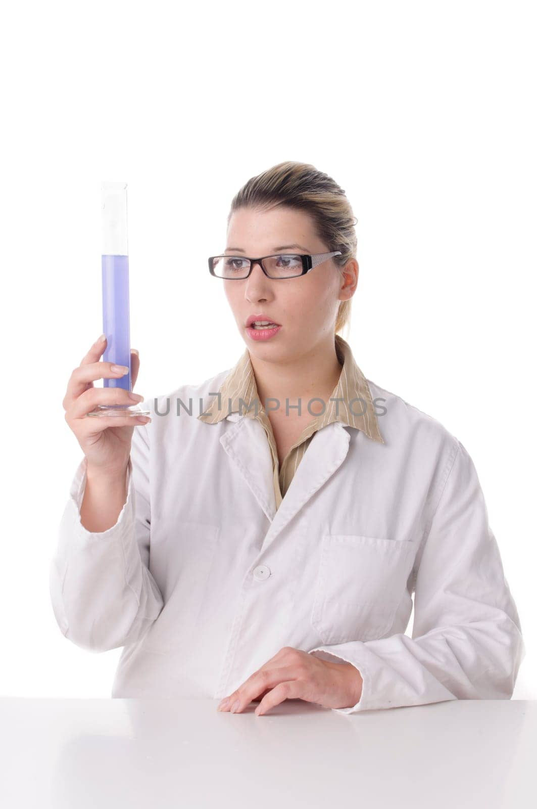 A young pretty woman wears a white coat and handles chemicals and glass bulbs,insulated against a white background.