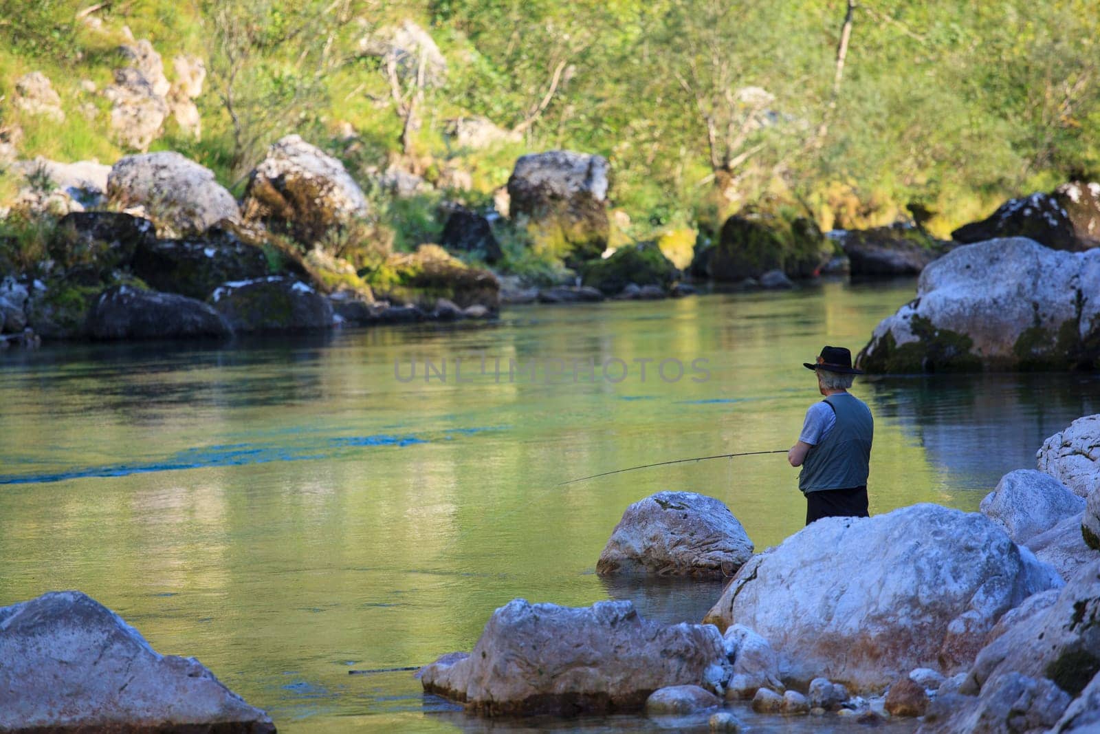 Photo of a Fisherman in the Soca river, Slovenia