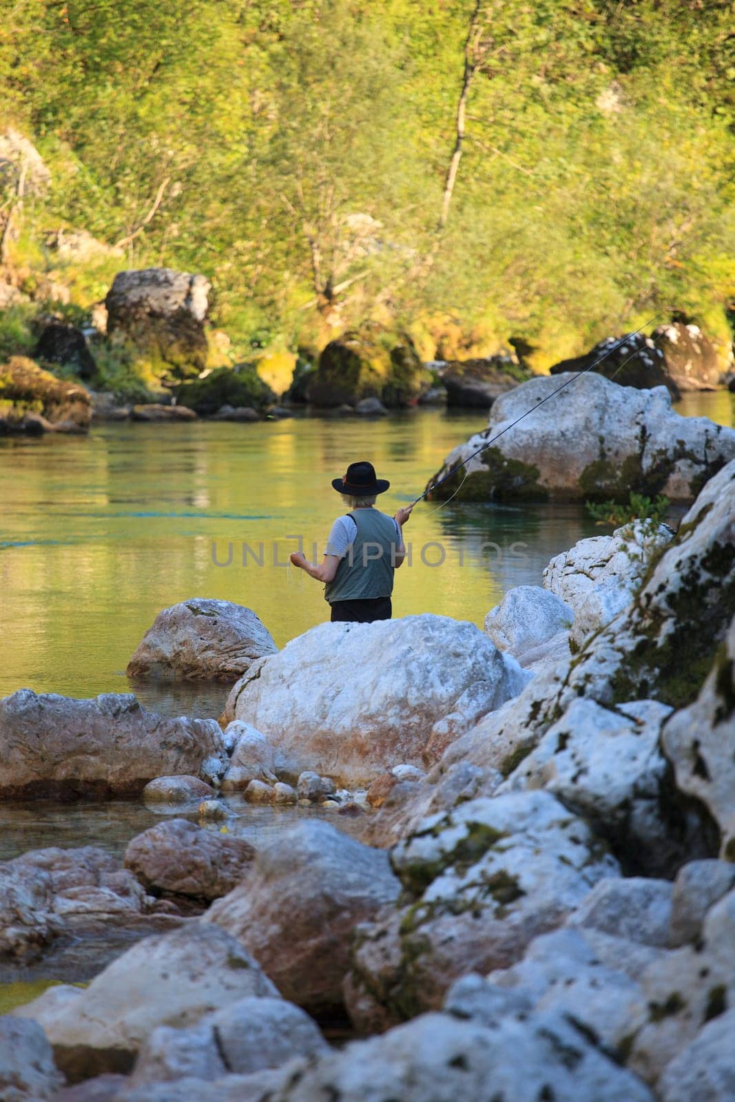 Photo of a Fisherman in the Soca river, Slovenia