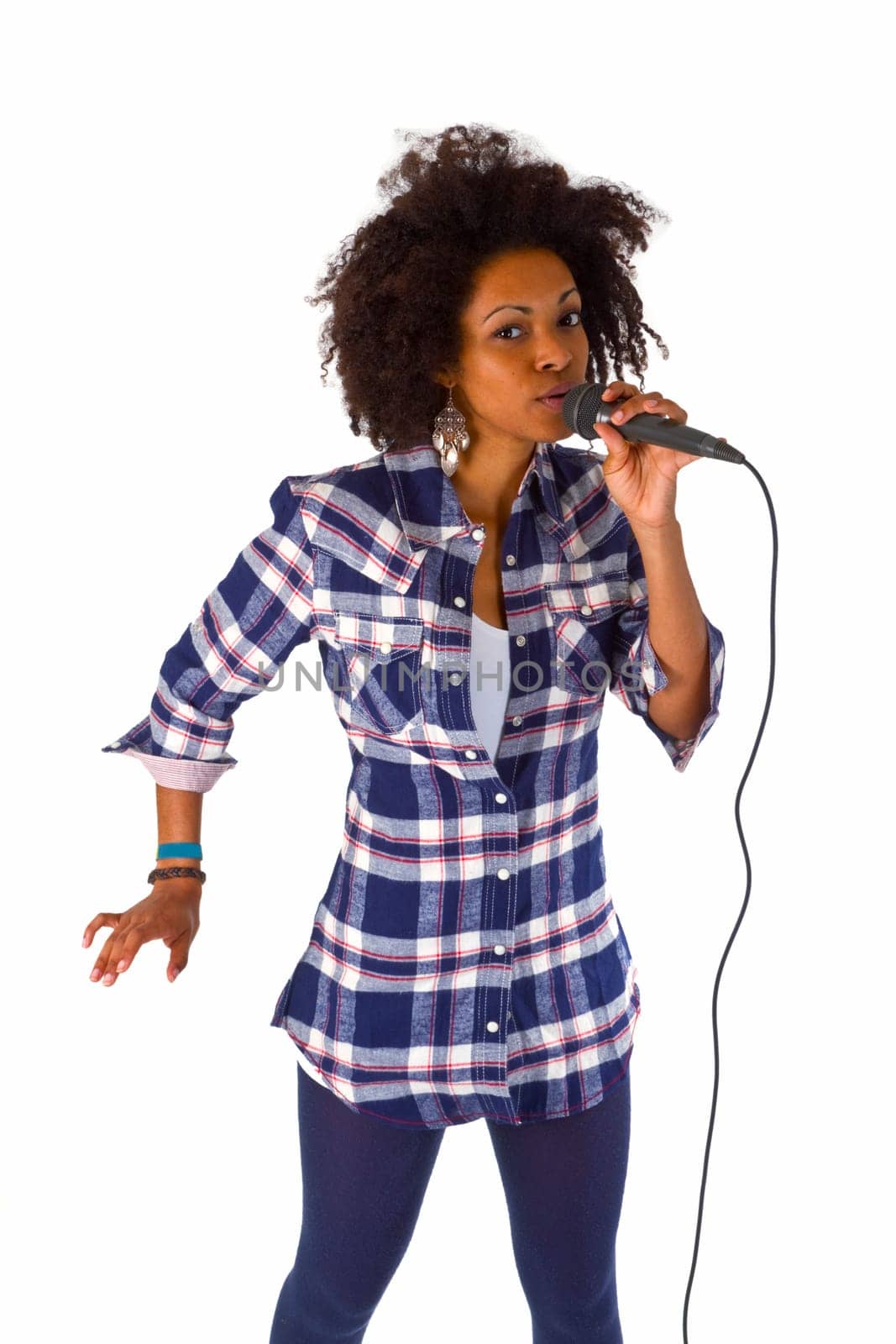 Pretty dark-skinned woman with microphone cropped on white background
