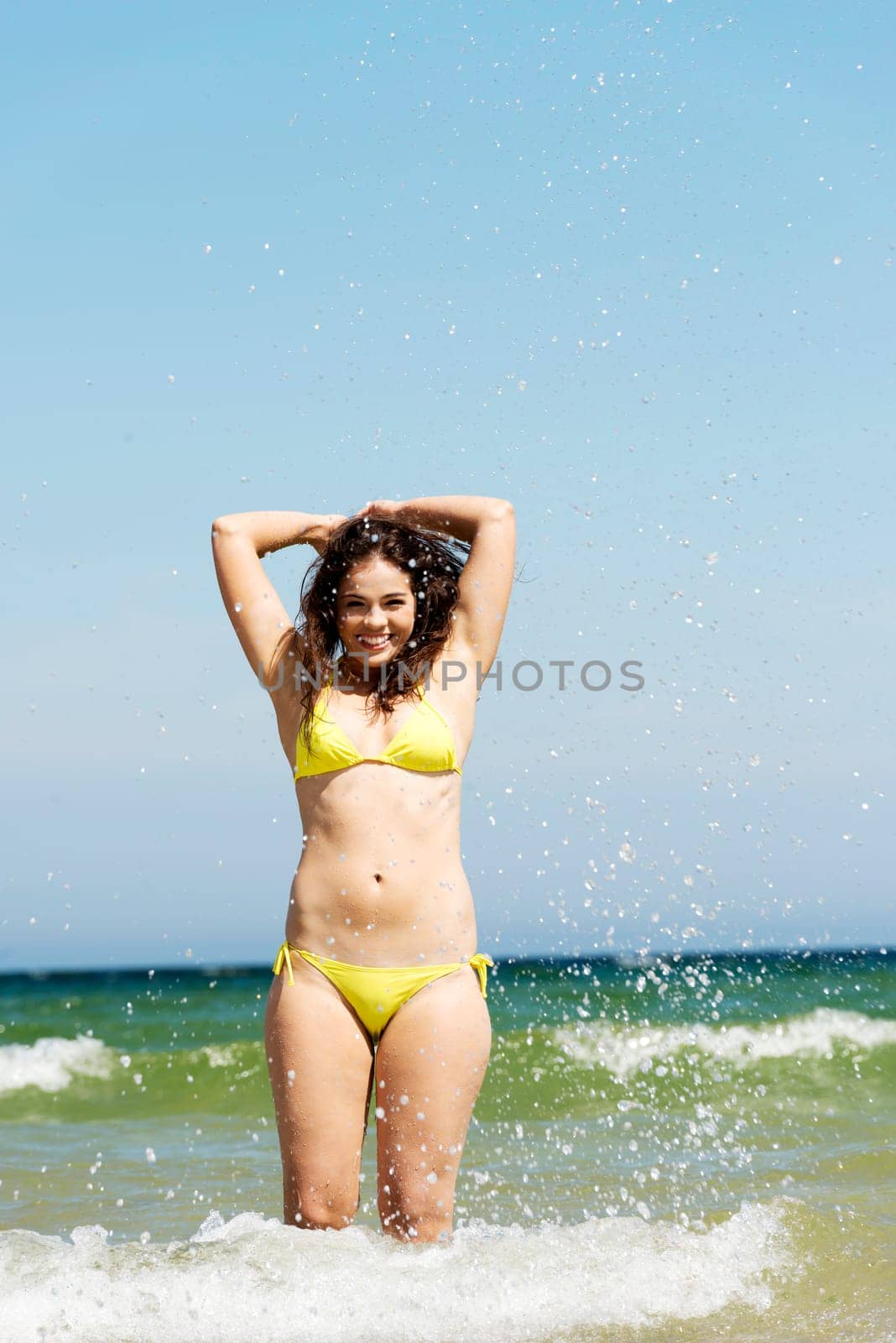 happy summer woman playing by the sea or ocean on vacation.