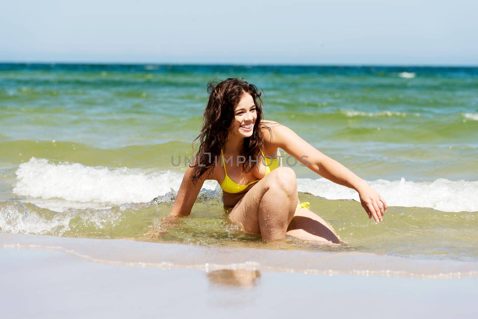 happy summer woman playing by the sea or ocean on vacation.