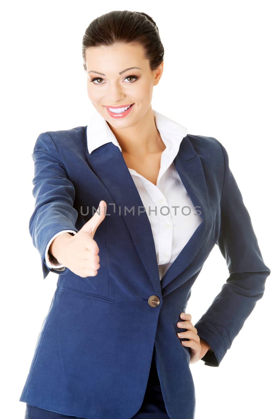 a beautiful businesswoman about to shake hands. isolated on white
