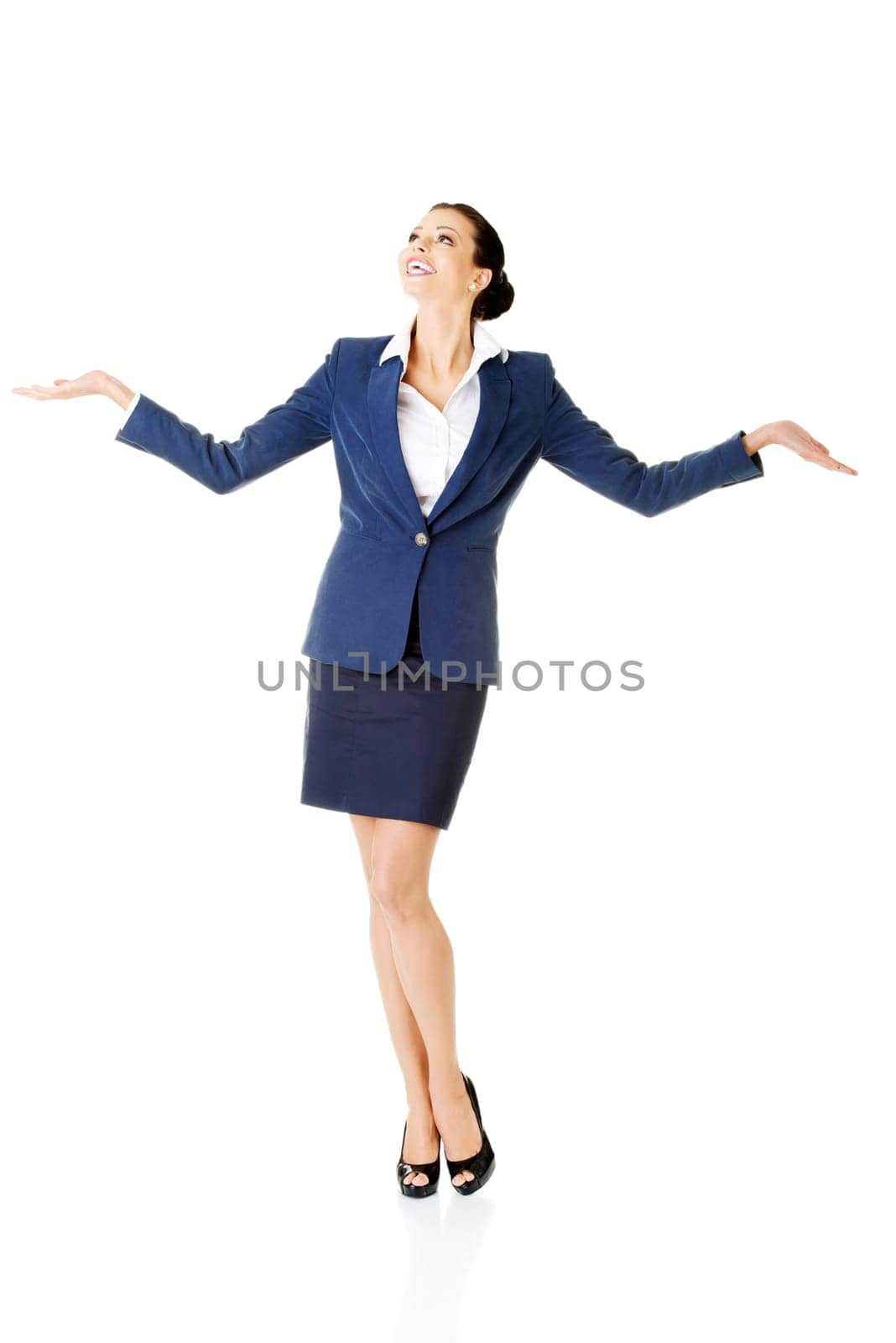 happy young business woman showing copy space on her palm,isolated on white