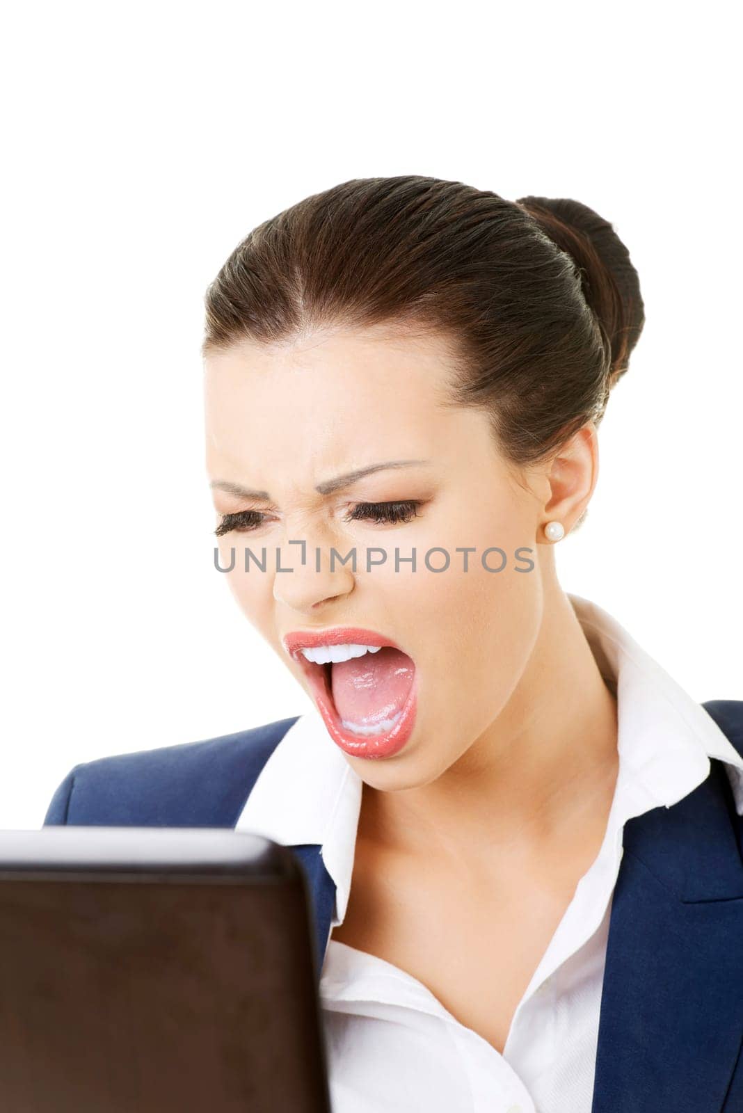 angry businesswoman shouting on her laptop,isolated on white