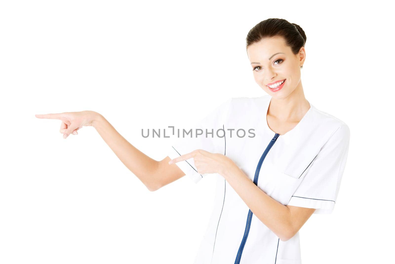 woman doctor or nurse pointing on copy space. isolated on white