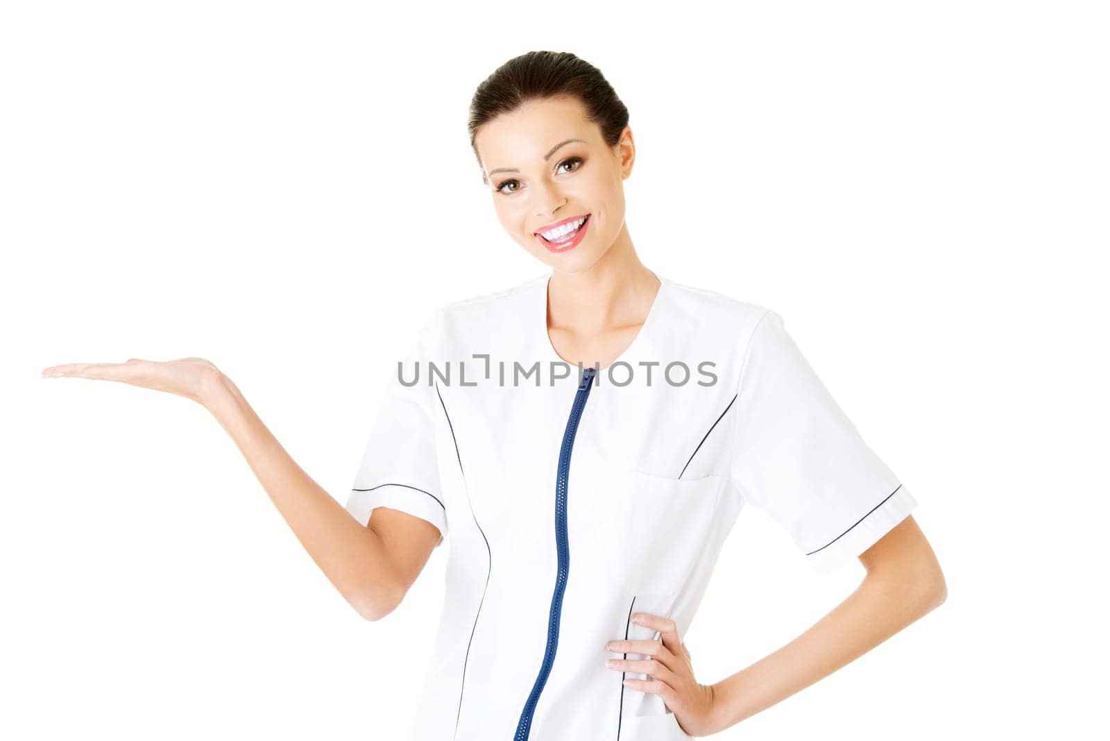 medical doctor or nurse woman presenting and showing copy space for product or text isolated on white background