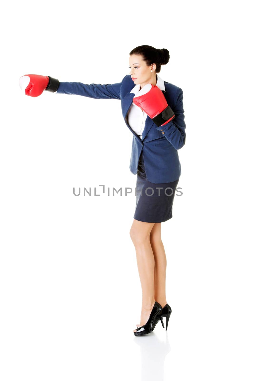 young businesswoman with boxing gloves,isolated on white background