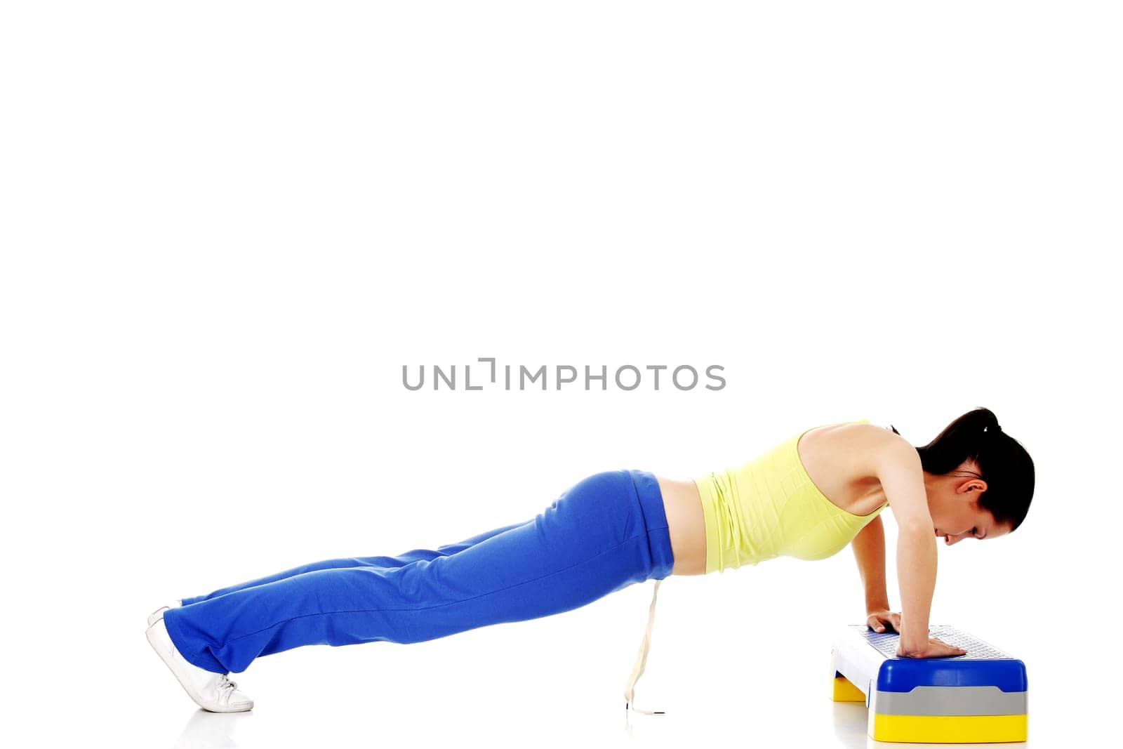 fitness girl is working out with stepper,isolated on white background