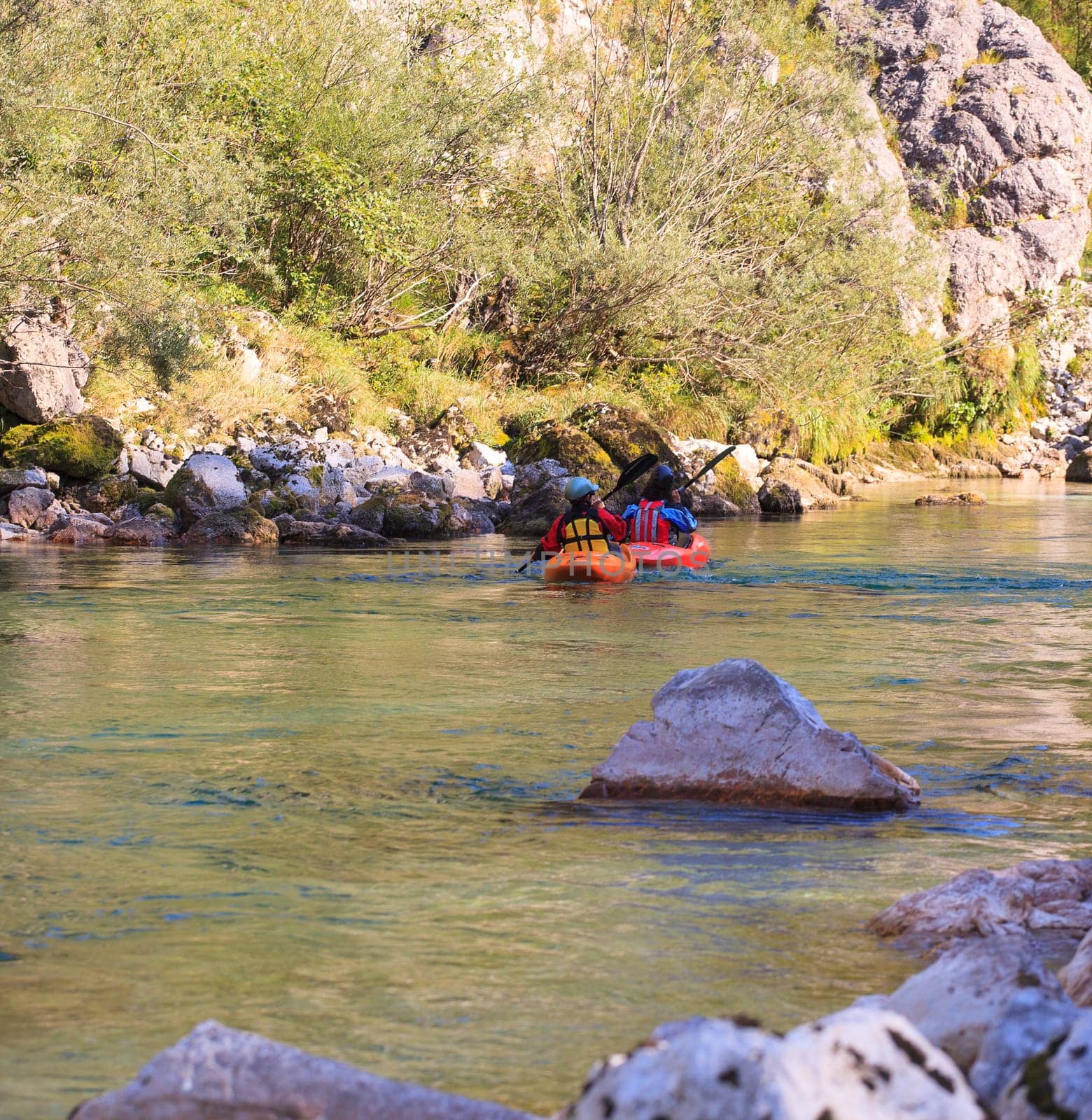 Kayaking in the summer on the Soca river, Slovenia