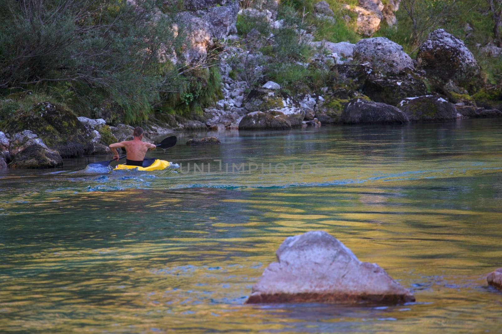 Kayaking in the summer on the Soca river, Slovenia