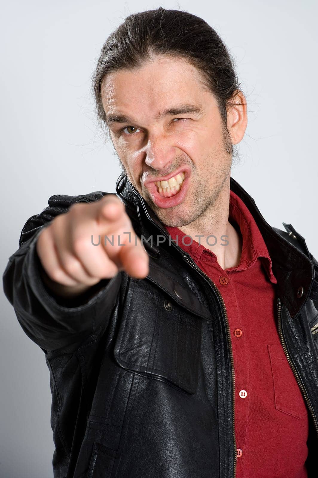 man is pointing in to the camera