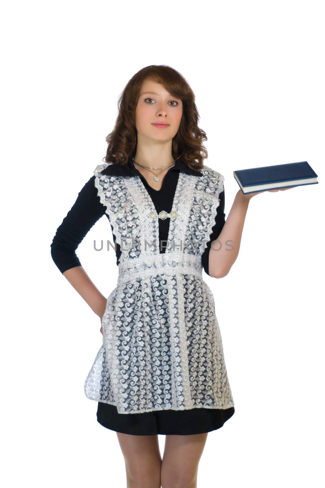 The girl in a school uniform with a book in hand