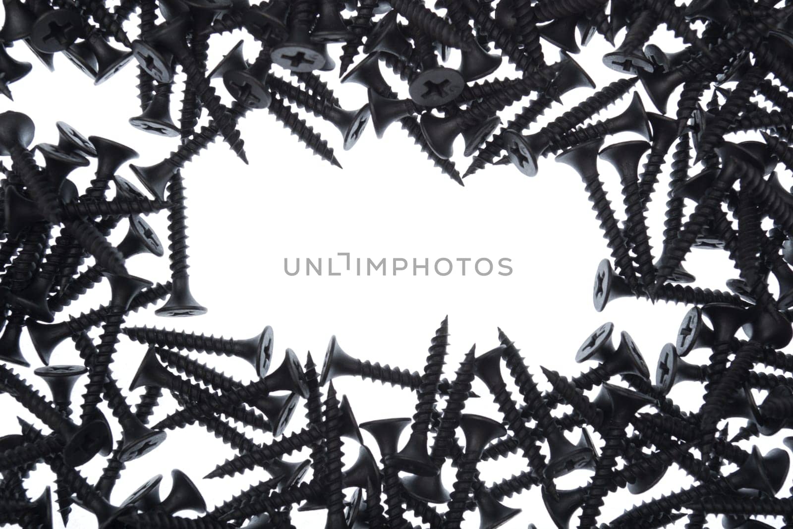 frame of black screws on white background