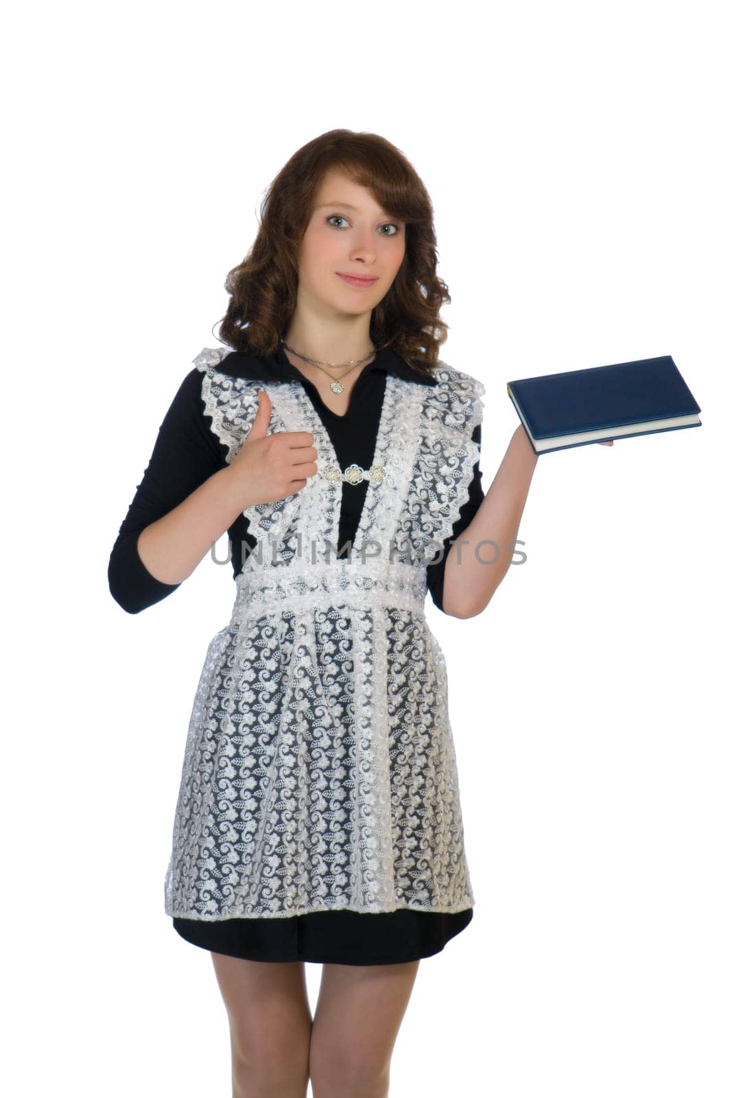 The girl in a school uniform with a book in hand