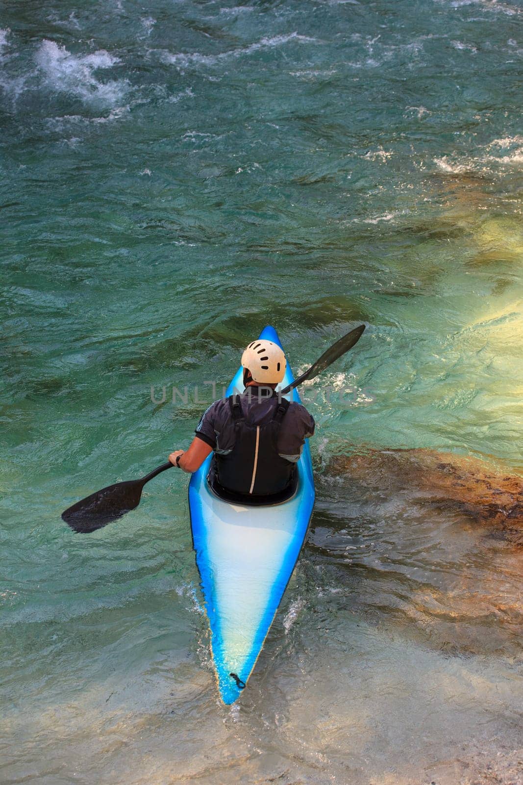 Kayaking in the summer on the Soca river, Slovenia