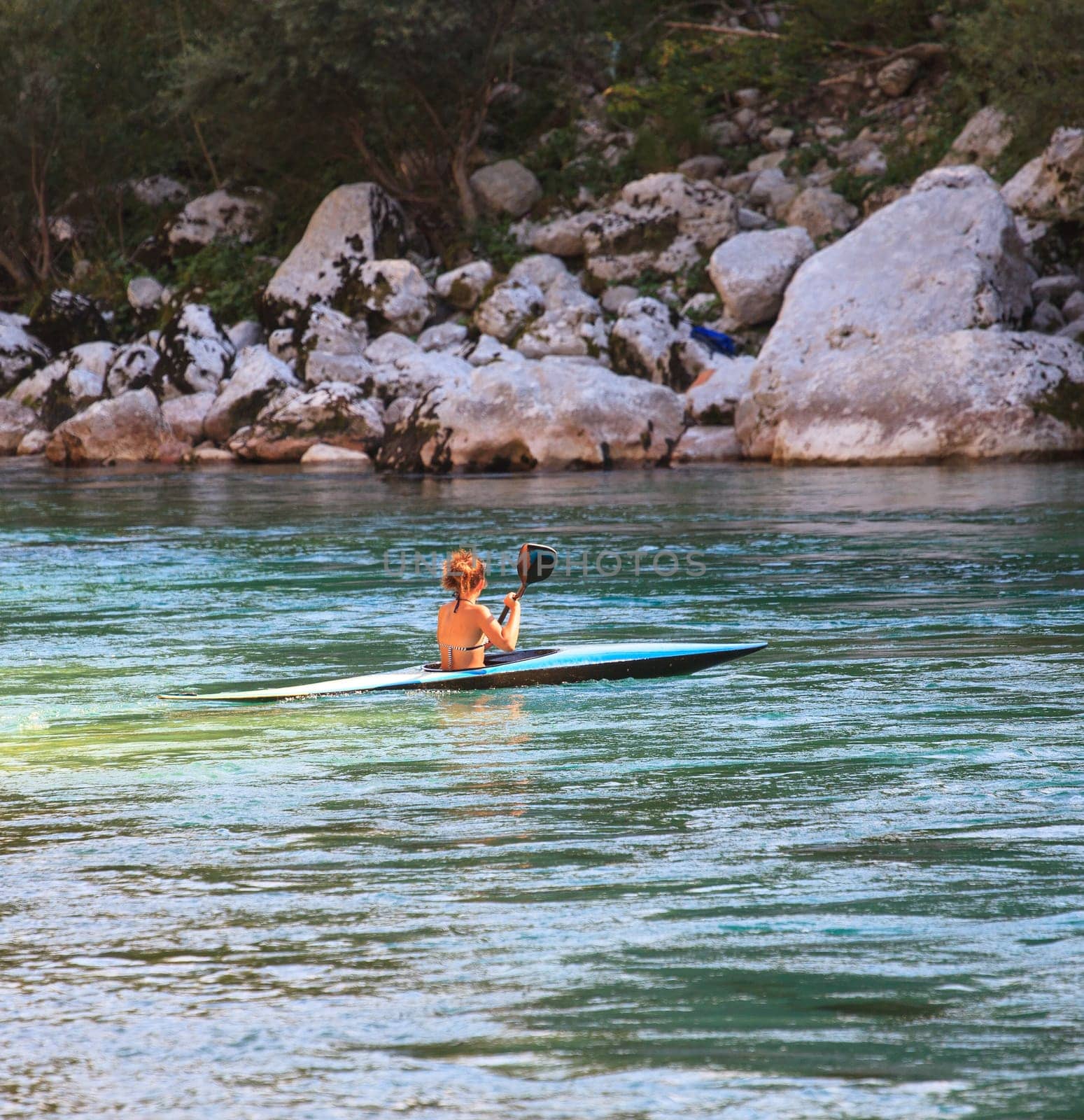 Kayaking in the summer on the Soca river, Slovenia