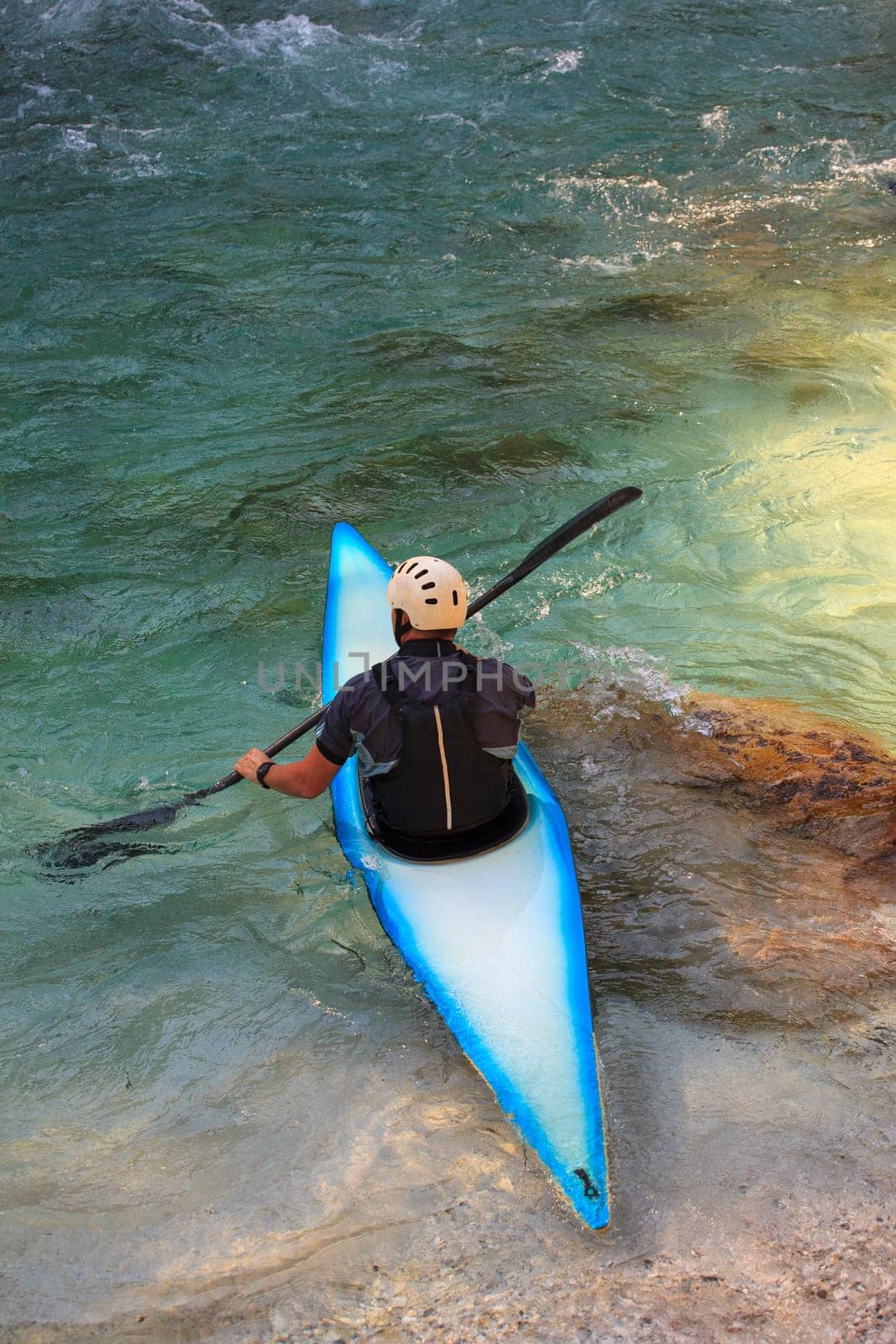 Kayaking in the summer on the Soca river, Slovenia