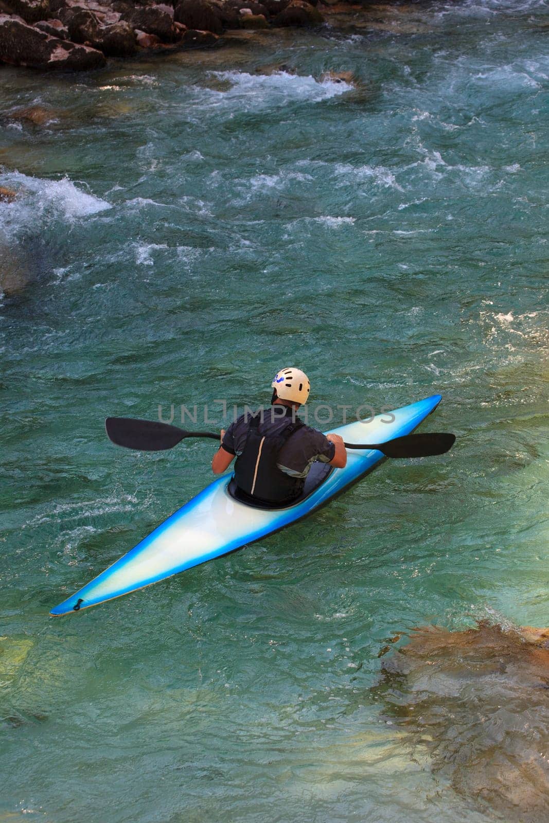 Kayaking in the summer on the Soca river, Slovenia