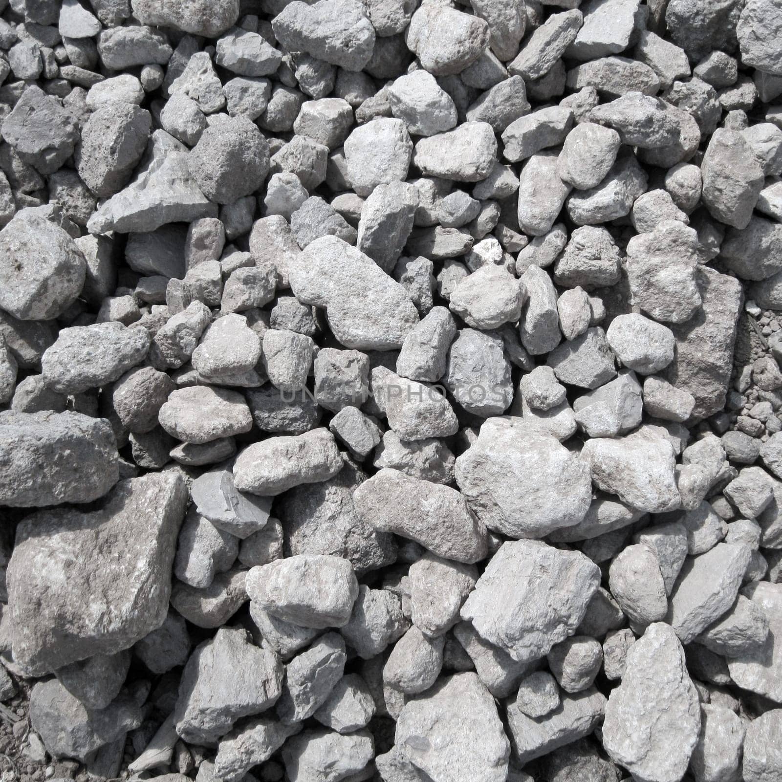Square shot of grey pebbles and gravel and stone