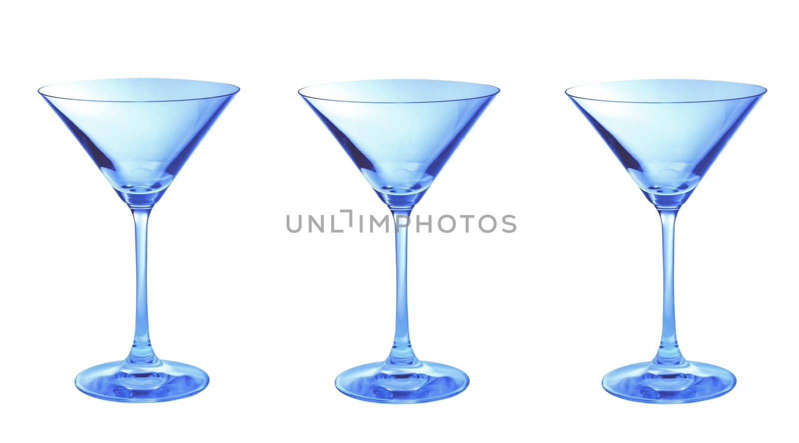 Three blue empty martini glasses in a row isolated