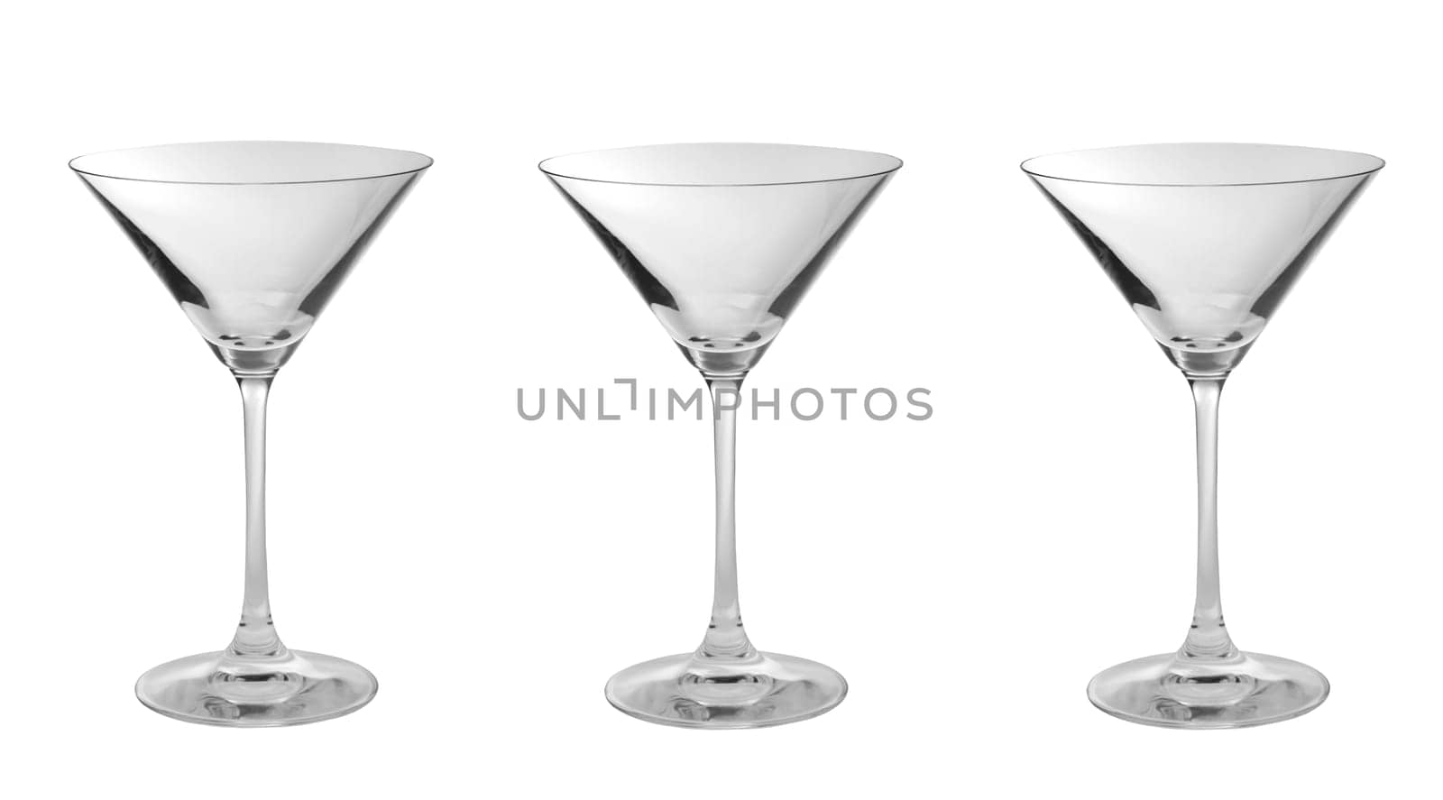 Three empty martini glasses in a row isolated