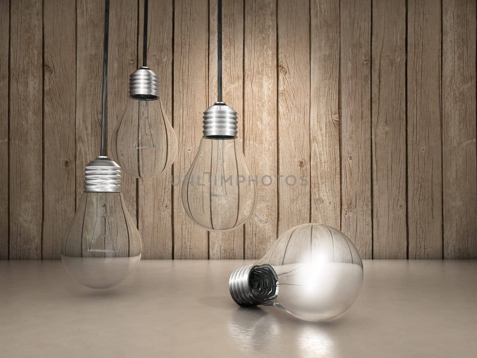 Three light bulbs hanging and one lighted up on the floor