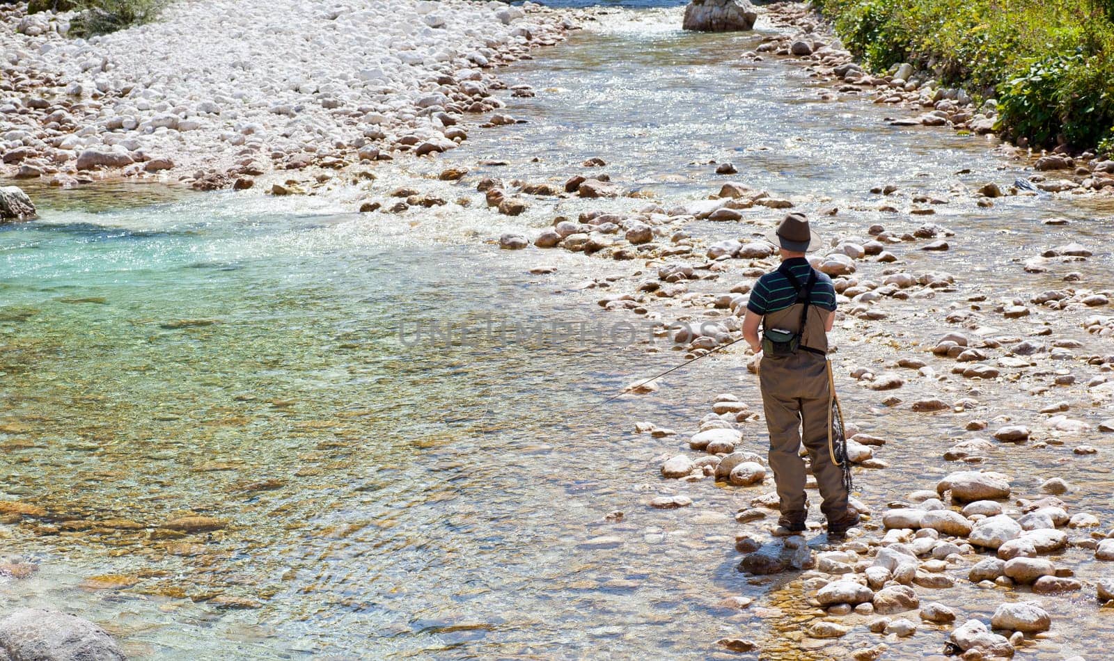 Photo of a Fisherman in the Soca river, Slovenia
