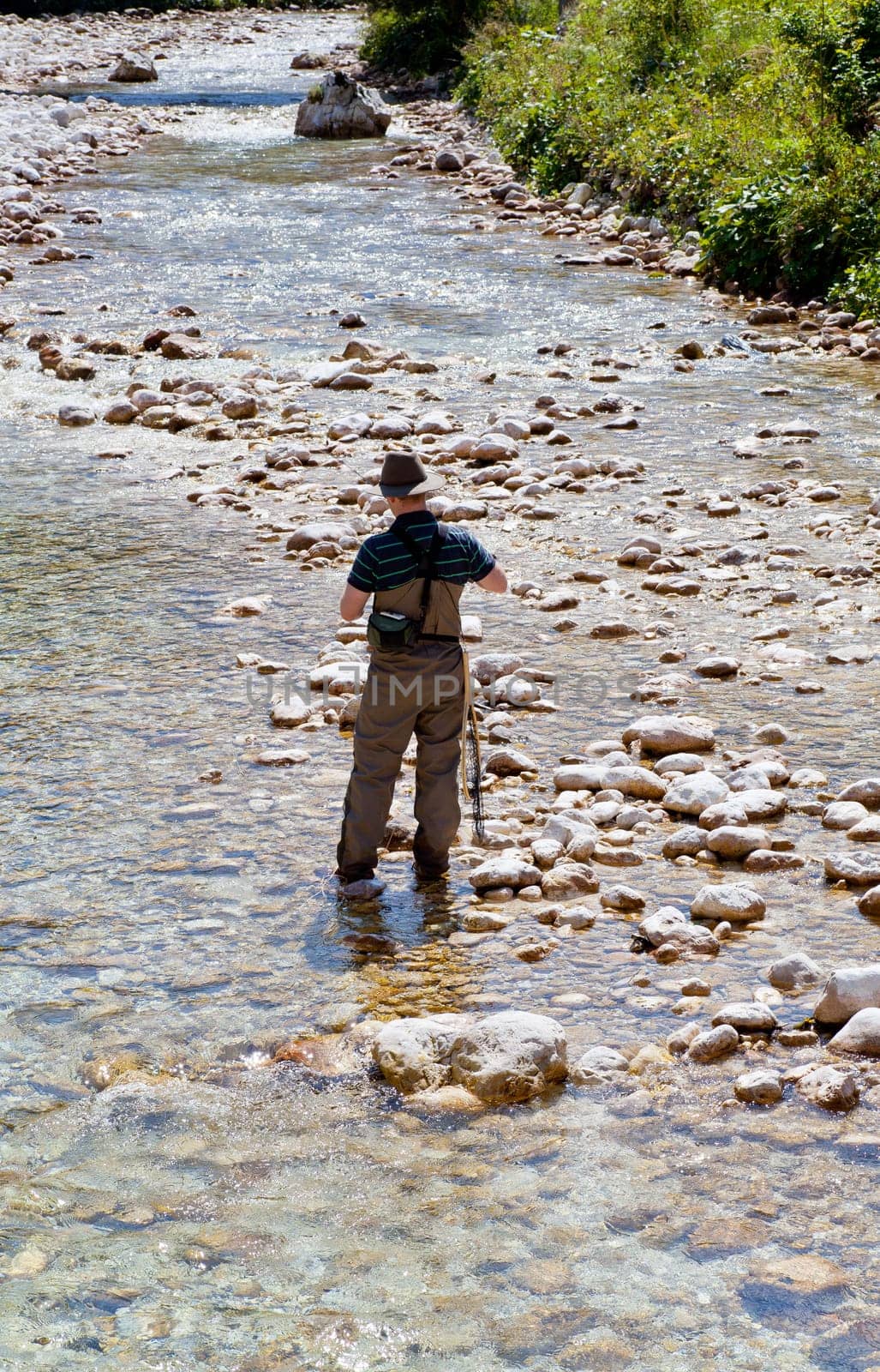 Photo of a Fisherman in the Soca river, Slovenia