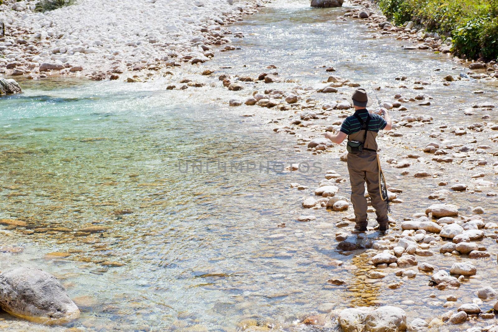 Photo of a Fisherman in the Soca river, Slovenia