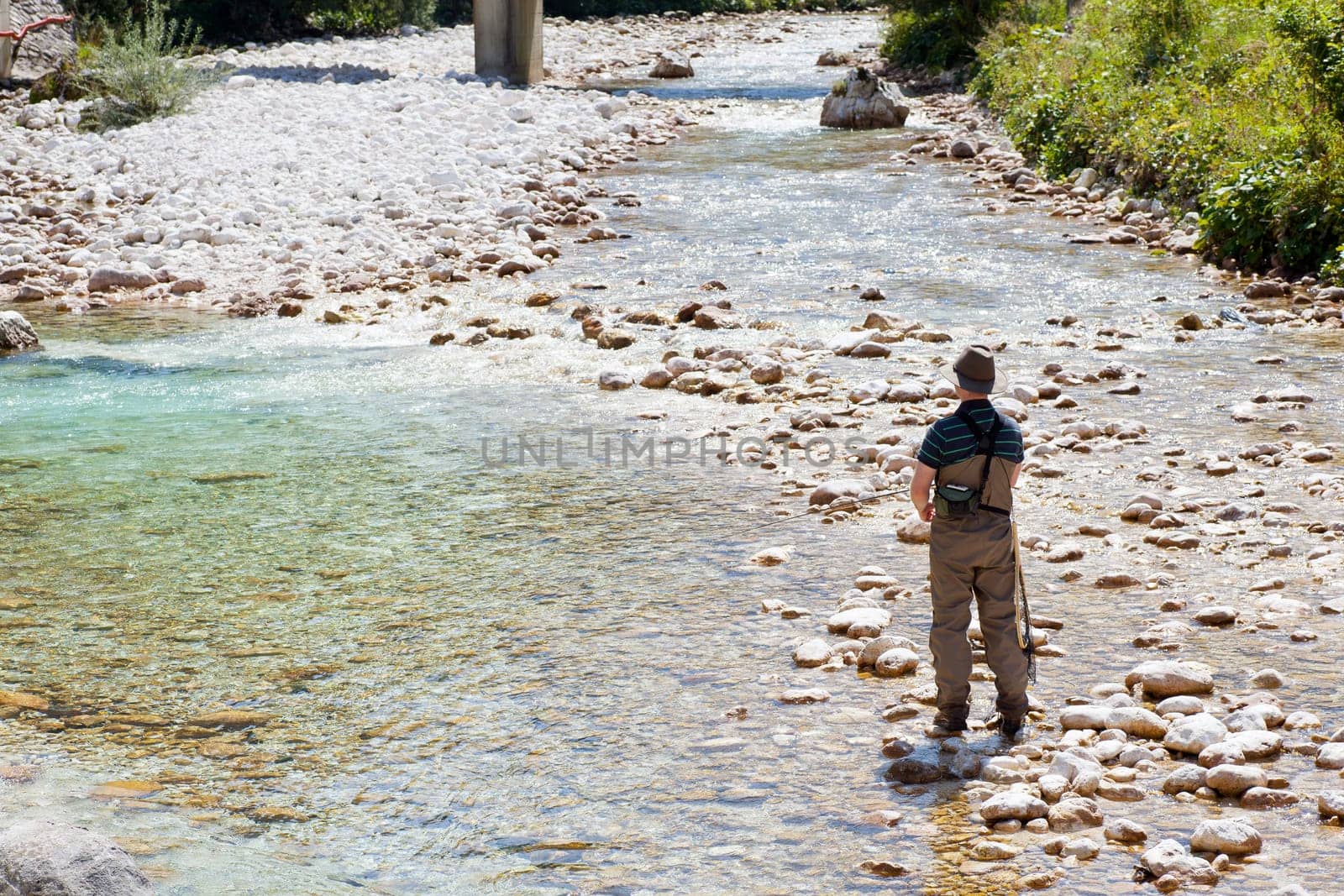 Photo of a Fisherman in the Soca river, Slovenia