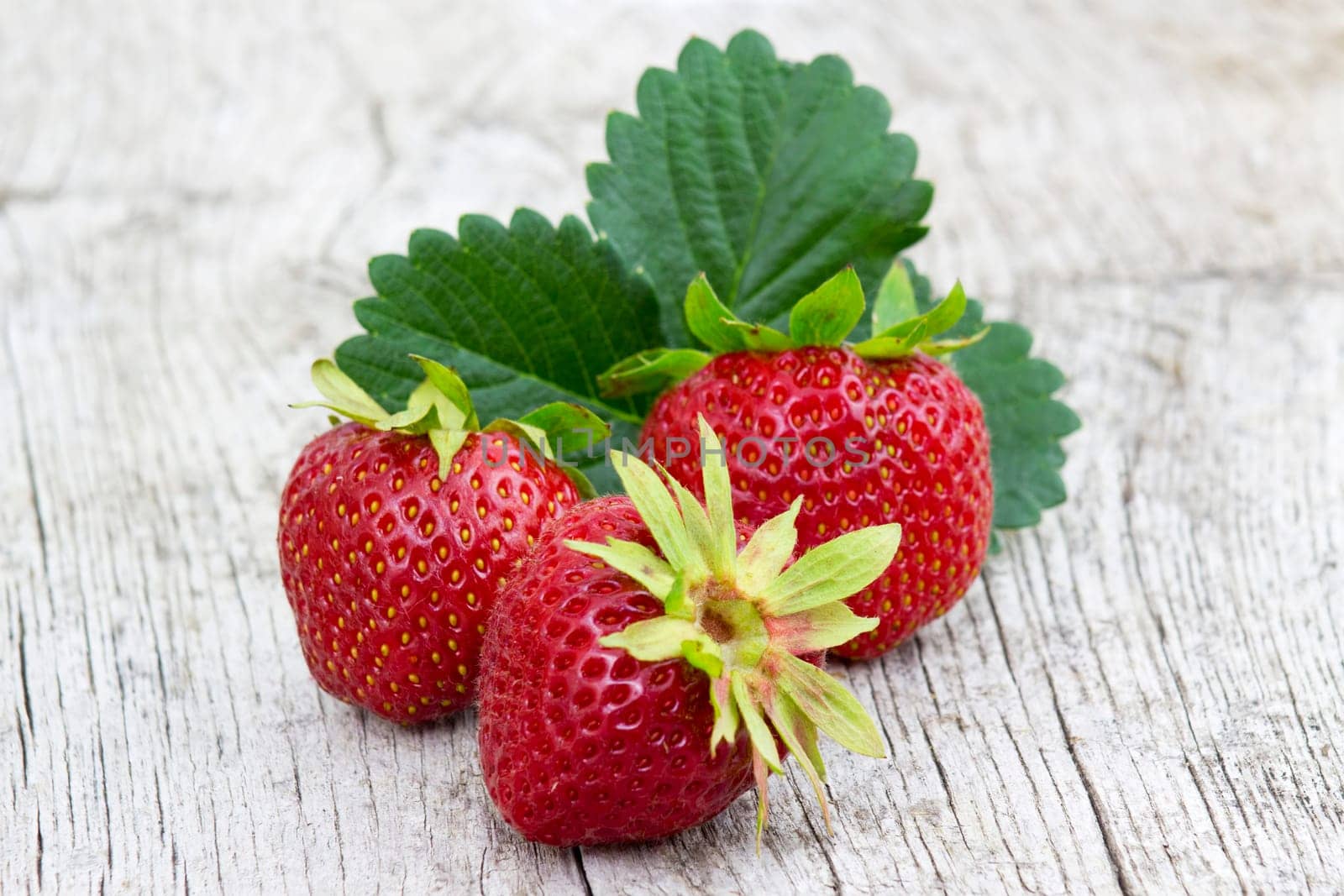 fresh strawberries on wooden background