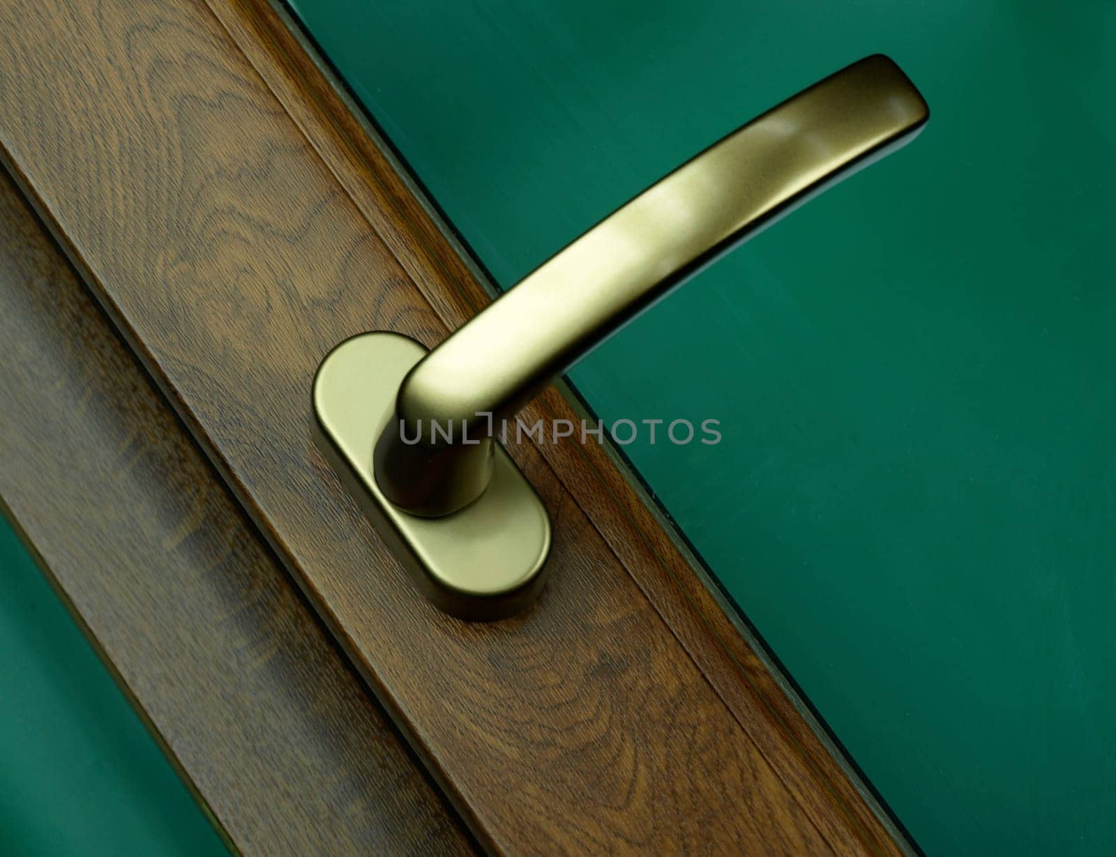 an elegant handle of the wooden door