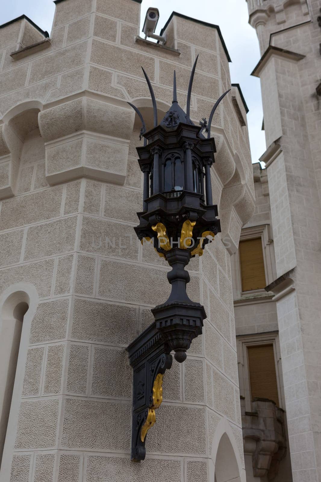 Street lamp on the wall of the castle Hluboka nad Vltavou near Ceske Budejovice, Czech Republic
