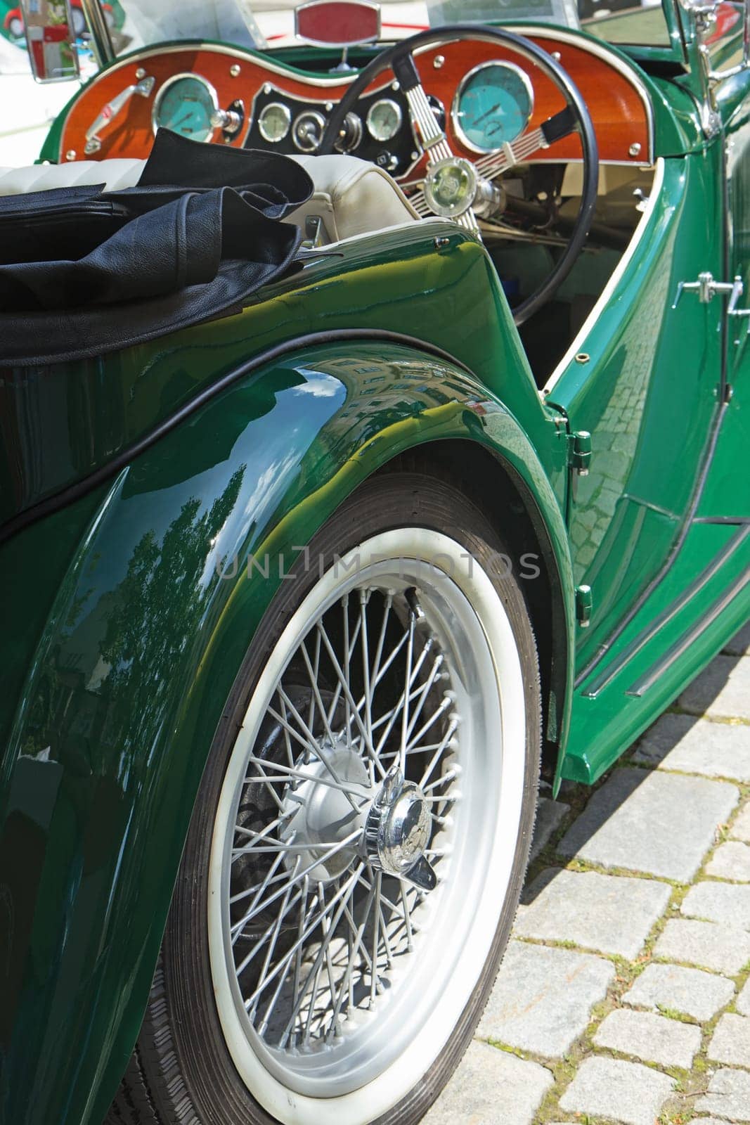 Closeup view of oldtimer green car. Rear view.